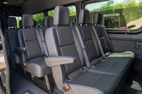 the interior of a van with black leather seats